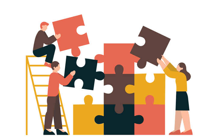 Three people putting a lifesize puzzle together